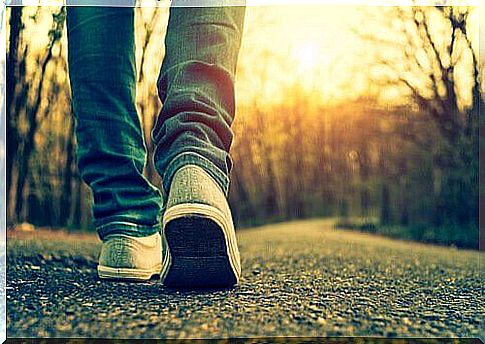 person walking on empty road