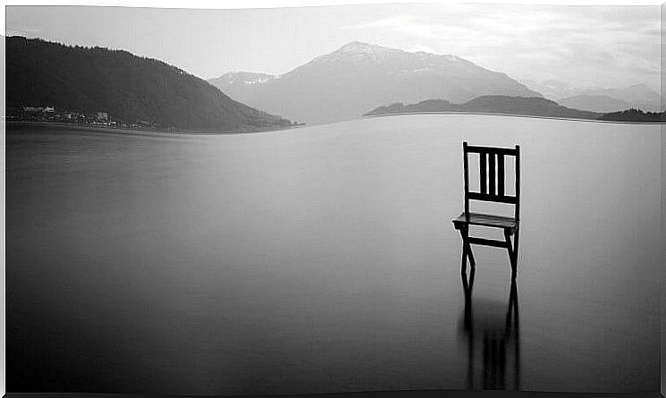 solitary chair on lake