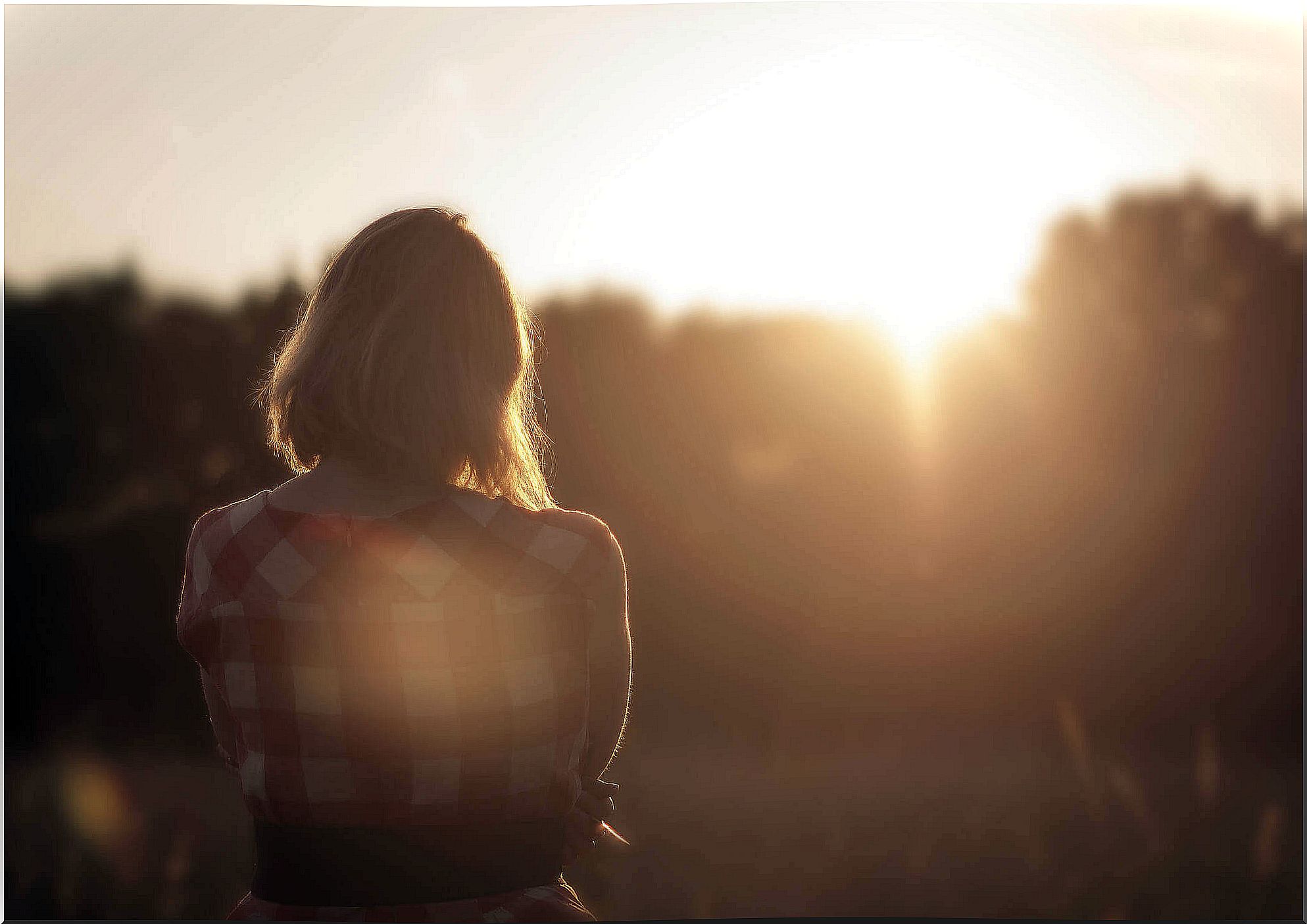 woman watching the sun