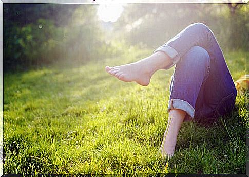 person relaxing on the grass