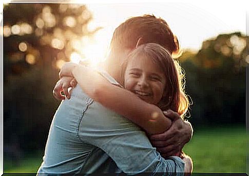 happy girl hugging her father