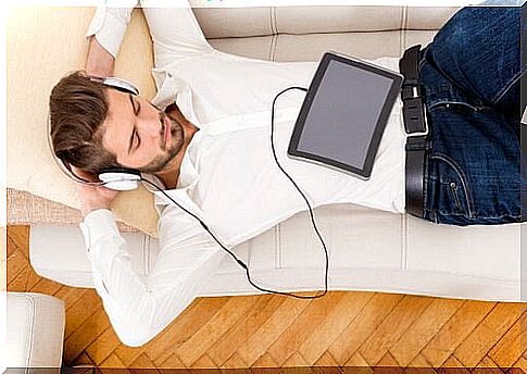 man relaxing and listening to music