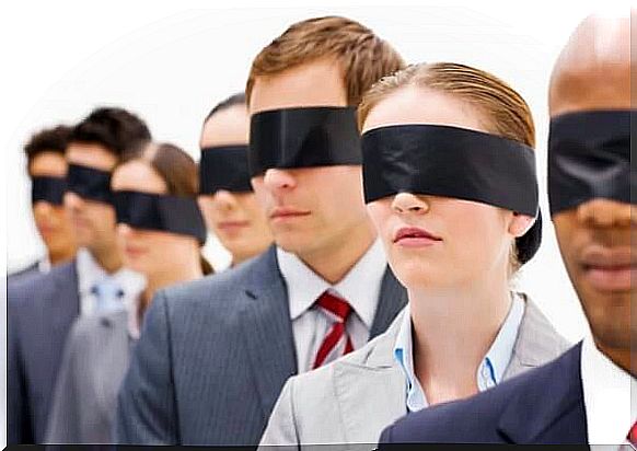 Blindfolded people representing social blindness