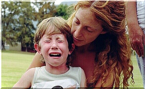 mother trying to calm down crying son