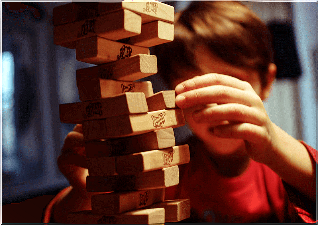 boy playing at building tower