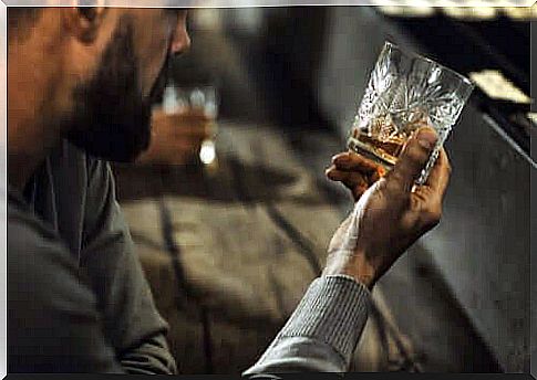 man drinking in bar