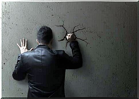 man punching the wall