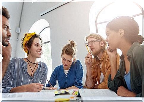 Group of students discussing with each other