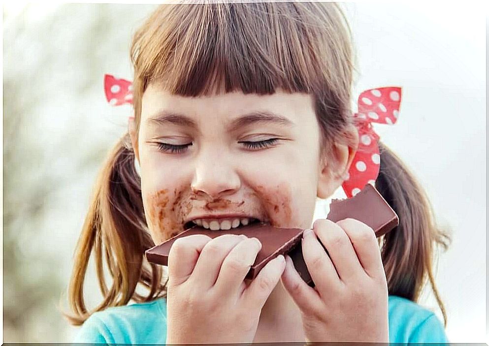 girl eating chocolate