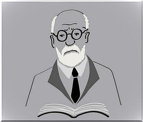 Freud holding a book