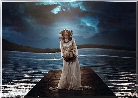 Woman on pier holding boat